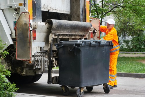 Operative wearing PPE while handling waste
